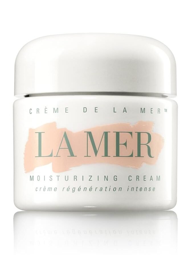 A classic white jar of La Mer Crème de la Mer moisturizing cream, a top choice among luxury skincare products for dry skin.