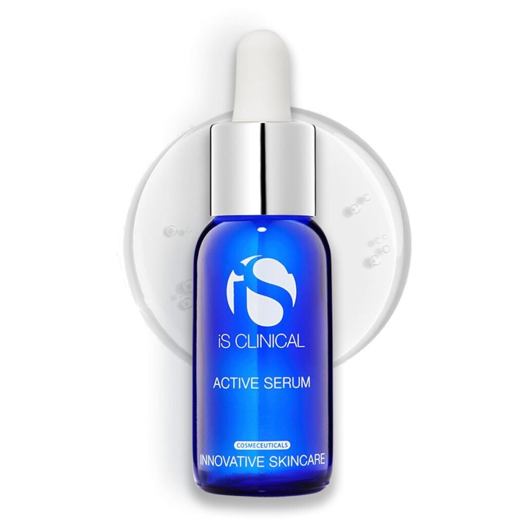 A dark blue glass dropper bottle of iS Clinical Active Serum, showcasing clinical-grade luxury skincare products for acne-prone skin.